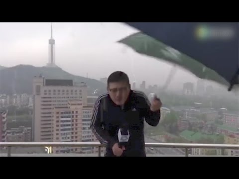Footage: News anchor hit by lightning while reporting in rainstorm